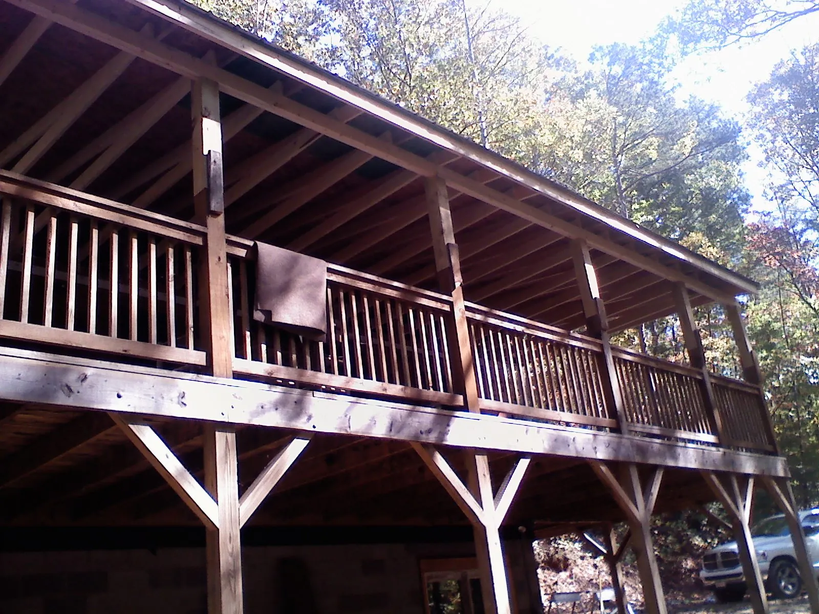 Timber framing under a new elevated porch and deck in Keysville